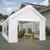 A white party tent set up next to a house, with outdoor furniture inside. Produktbild-Vorschau