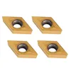 Four gold-colored diamond-shaped CNC carbide inserts with a gray metal center hole are arranged in a two-by-two grid on a white background. Náhľad obrázku produktu