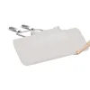 A hand is shown holding the edge of a beige bed rail, which is attached to a metal frame. Voir les images du produit