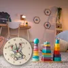 A child's room with a desk, chair, toys, and a clock. Produktbild-Vorschau