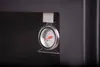 A close-up shot of a thermometer attached to a dark appliance. Produktbild-Vorschau