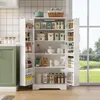 A white kitchen cabinet filled with various food items and kitchenware, positioned in a kitchen setting with a window view of greenery in the background. Náhľad obrázku produktu
