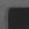 A close-up view of a textured gray surface meeting a black grid-like pattern. Podgląd zdjęcia produktu