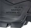 A close-up view of the sole of a black shoe, showing embossed text indicating its features. Anteprima dell’immagine prodotto