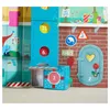 A colorful, festive scene depicting elements of a Christmas factory, likely part of an advent calendar. Voir les images du produit