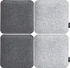 Four square felt seat cushions, two dark gray and two light gray, are arranged in a 2x2 grid on a white background. Produktbild-Vorschau