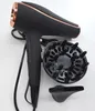 A black hairdryer with rose gold accents and its attachments are laid out on a white surface. Podgląd zdjęcia produktu