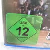A close-up of a video game case with a rating label. Produktbild-Vorschau
