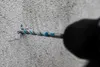 A drill bit is drilling into a concrete wall. Podgląd zdjęcia produktu