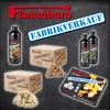 A collection of Flammburo products, including bottles of liquid firestarter, boxes of firestarter cubes, and bags of firestarter wool, displayed on a dark, textured background. Produktbild-Vorschau