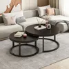 A living room scene with a sectional sofa and two round coffee tables. Produktbild-Vorschau