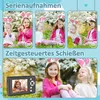 A collage of images showing children wearing bunny ears, with text overlays indicating camera features like 'Serienaufnahmen' (continuous shooting) and 'Zeitgesteuertes Schießen' (timed shooting). One image also shows a digital camera. Produktbild-Vorschau