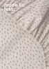 A close-up of a patterned fabric, likely a bedsheet, with text overlay. Produktbild-Vorschau