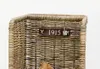 A close-up view of a wicker basket with a sign that reads '1915'. Produktbild-Vorschau