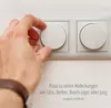 A hand is shown adjusting a dimmer switch, with text indicating compatibility with various brands. Produktbild-Vorschau