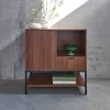 A wooden sideboard with a black metal frame against a concrete wall. Anteprima dell’immagine prodotto