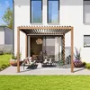 A modern patio with a pergola, outdoor furniture, and potted plants. Náhled obrázku produktu