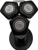 A close-up, top-down view of a Philips electric shaver head with three rotary blades, resting on its charging base. Produktbild-Vorschau
