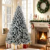 A decorated Christmas tree in a living room setting with a fireplace. Produktbild-Vorschau