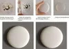 Collage of images showing the assembly steps of a white circular light fixture. Produktbild-Vorschau