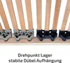 Close-up view of wooden slats of a bed frame with plastic connectors. Produktbild-Vorschau