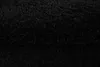 A close-up view of black, fluffy material, likely a rug or carpet. Voir les images du produit