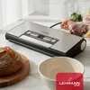 A vacuum sealer is shown on a kitchen counter next to a loaf of bread and a bowl, with several vacuum-sealed food bags in the background. Anteprima dell’immagine prodotto