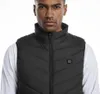A man wearing a black heated vest over a white shirt. Náhľad obrázku produktu