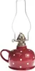A red polka dot oil lamp with a clear glass chimney. Náhled obrázku produktu
