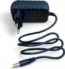 A black power adapter with a European plug and a coiled cable ending in a DC barrel connector. Podgląd zdjęcia produktu