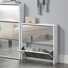 A white shoe cabinet with mirrored doors is shown in a room with a gray wall and wooden floor. A cream-colored handbag is placed on top of the cabinet. Anteprima dell’immagine prodotto