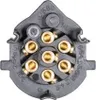 A close-up view of a 7-pin electrical socket with visible brass terminals and black plastic housing. Text and numbers are embossed on the plastic. Produktbild-Vorschau