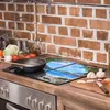 A kitchen counter with a stovetop and backsplash. Produktbild-Vorschau