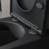 A close-up view of the hinges and mounting points of a black toilet seat and lid. Produktbild-Vorschau