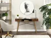 A modern home office setup with a desk, chair, bookshelf, and plant. Voir les images du produit
