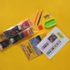 A diamond painting kit laid out on a yellow background, including bags of colored beads, a guide booklet, and tools. Produktbild-Vorschau
