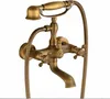 A close-up studio shot of a vintage-style brass bathtub faucet with a handheld showerhead. Náhled obrázku produktu