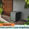 A storage box is placed on a patio next to a wooden fence and a wall. Produktbild-Vorschau