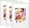 Three white picture frames are displayed, with the rightmost frame showing a close-up of a woman holding macarons. Produktbild-Vorschau