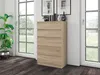 A chest of drawers in a room with large windows. Produktbild-Vorschau