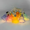 A string of colorful, bell-shaped LED lights. Produktbild-Vorschau