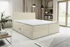 A beige and white striped boxspring bed with a mattress is shown in a well-lit room with curtains and a window in the background. Voir les images du produit