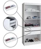 A white wardrobe with several shelves and drawers, some of which are open and contain folded clothes or shoes. There are also close-up insets showing details of the drawers and their contents. Produktbild-Vorschau