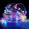 A coiled string of colorful LED lights against a dark background, with reflections on a surface below. Podgląd zdjęcia produktu