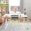 A white electric standing desk with a monitor, keyboard, and mouse, set up in a home office environment. Anteprima dell’immagine prodotto