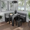 A dining set with a corner bench, table, and stool in a room with large windows. Náhled obrázku produktu