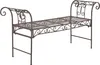 A metal garden bench with ornate scrollwork.