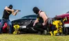 Two men in black ski masks and black tank tops are posing with pressure washers and cars. Produktbild-Vorschau