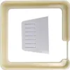 A square cream-colored frame surrounds a white, angled insert with multiple horizontal slots. Náhled obrázku produktu