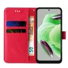 A red flip phone case with card slots and a banknote is shown open next to a smartphone. Produktbild-Vorschau